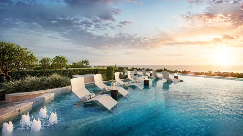 Sky Pool ของ The KUARTZ: เตียงอาบแดดในน้ำและวิวทะเล